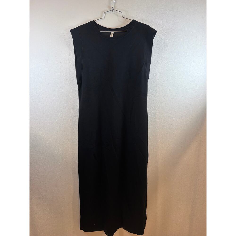 Long ankle length black dress.